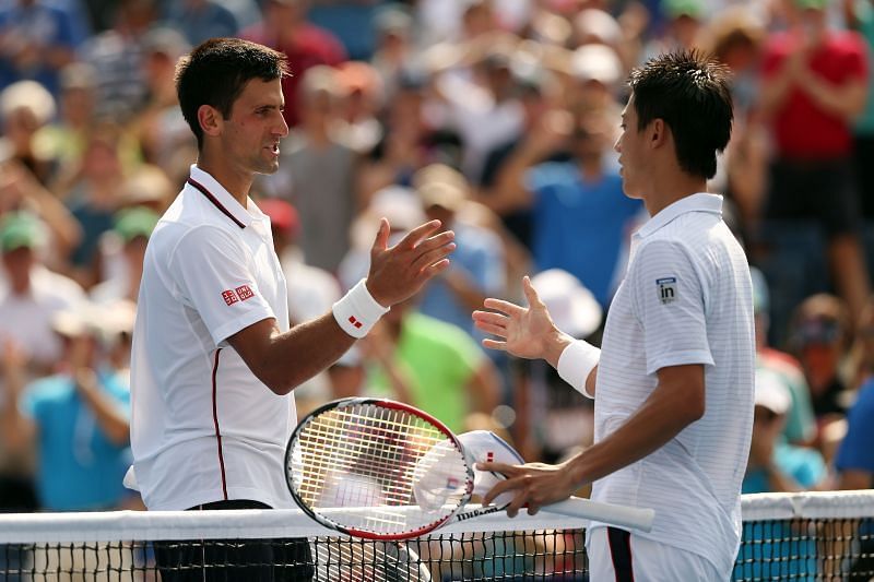 Novak Djokovic (L) a Kei Nishikori na US Open 2014