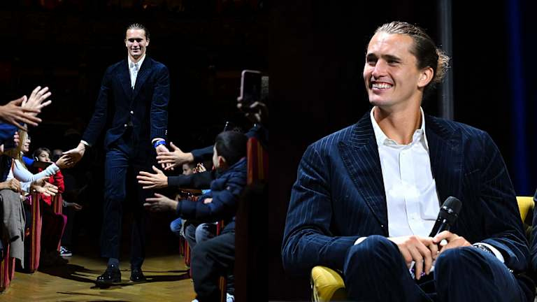 Alexander Zverev rockt een marineblauw pak met krijtstreep en een strak achterknotje.